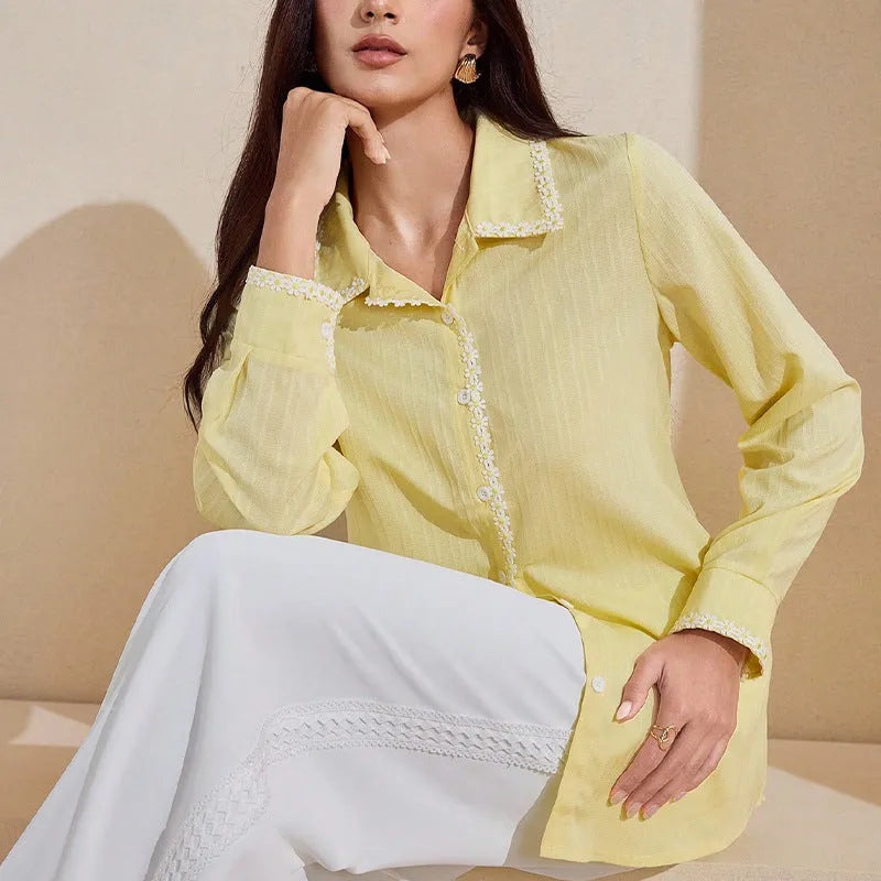 Women's solid yellow lace long-sleeved cardigan top with stitching detail on a plain background