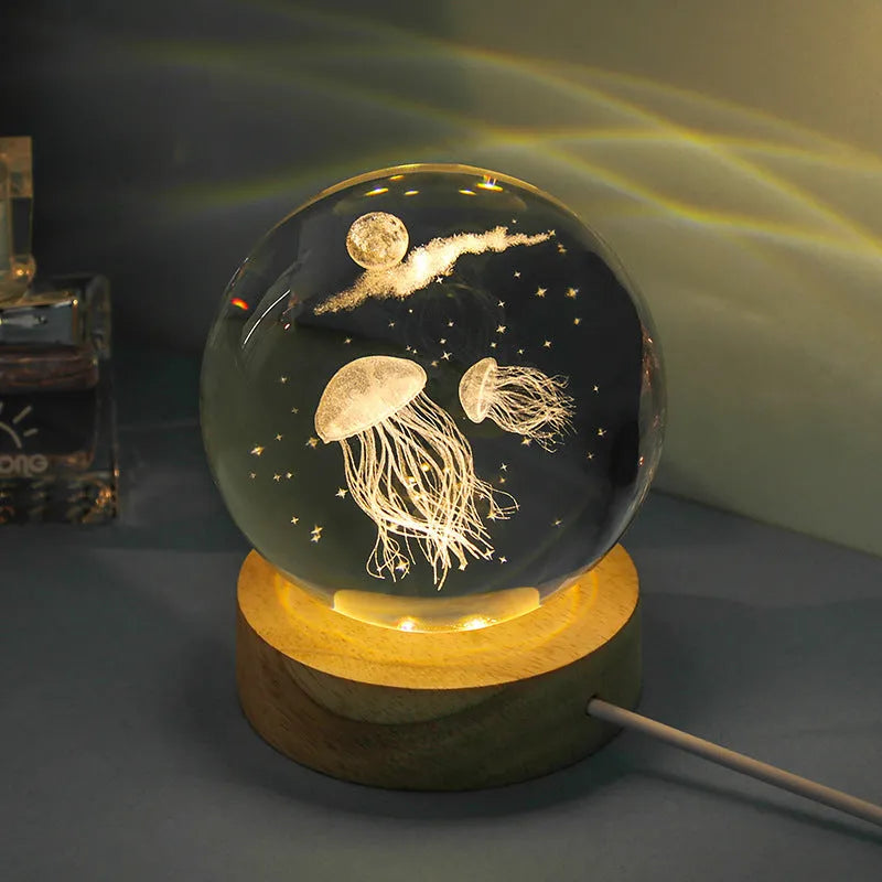 Transparent crystal ball night lamp with 3D carved jellyfish design, showing 6cm size on round base.