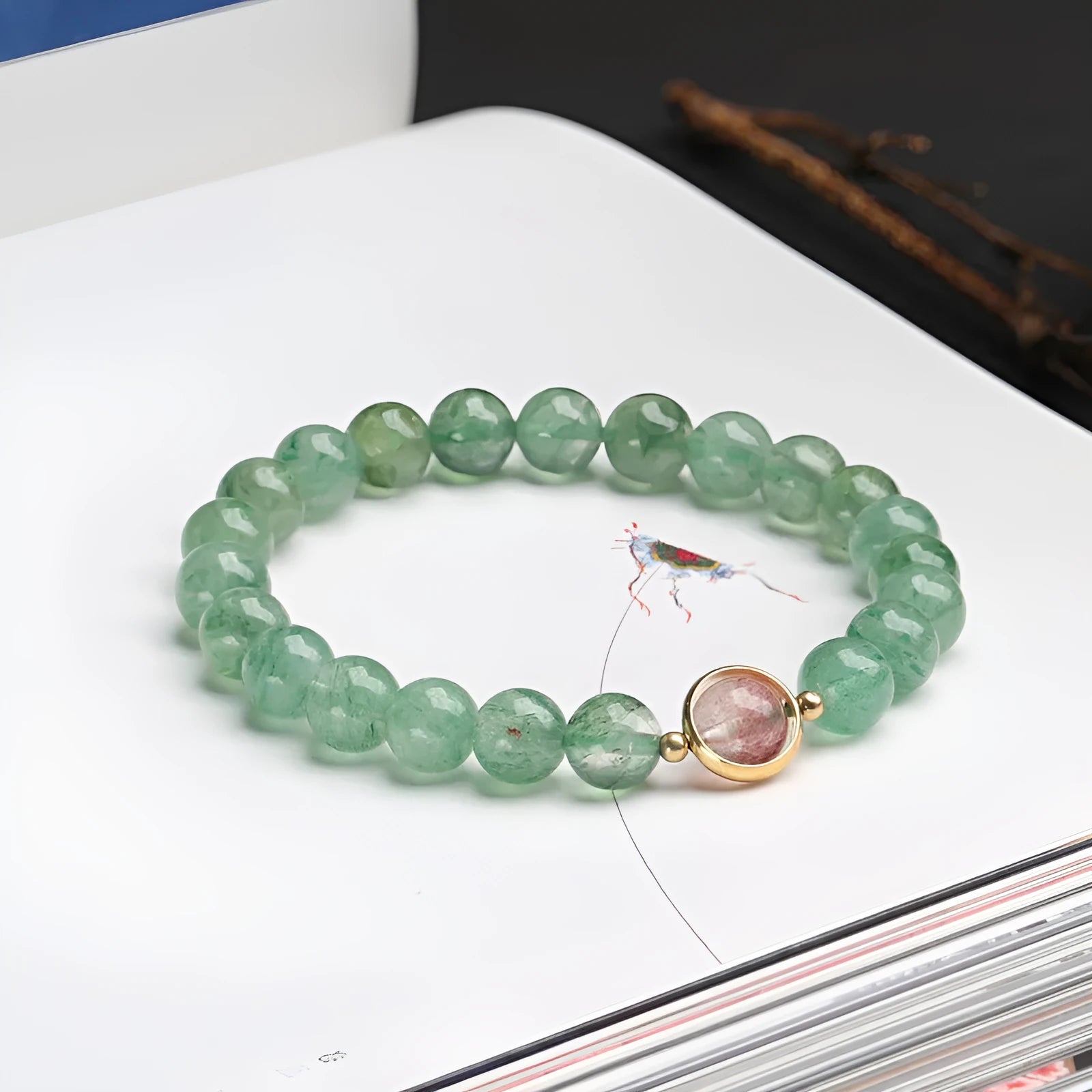Hand-woven green strawberry quartz bracelet with 7.5mm beads in Chinese style geometric design