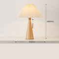 Handmade walnut wood small table lamp with beige pleated cloth shade and LED light on a desk