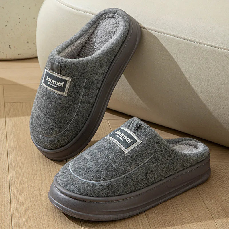 Men's grey suede slippers with thickened bottom and EVA sole showing extended sizing label