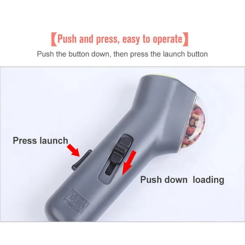 Grey plastic pet snack catapult launcher toy with a handle for dog and cat interactive training.
