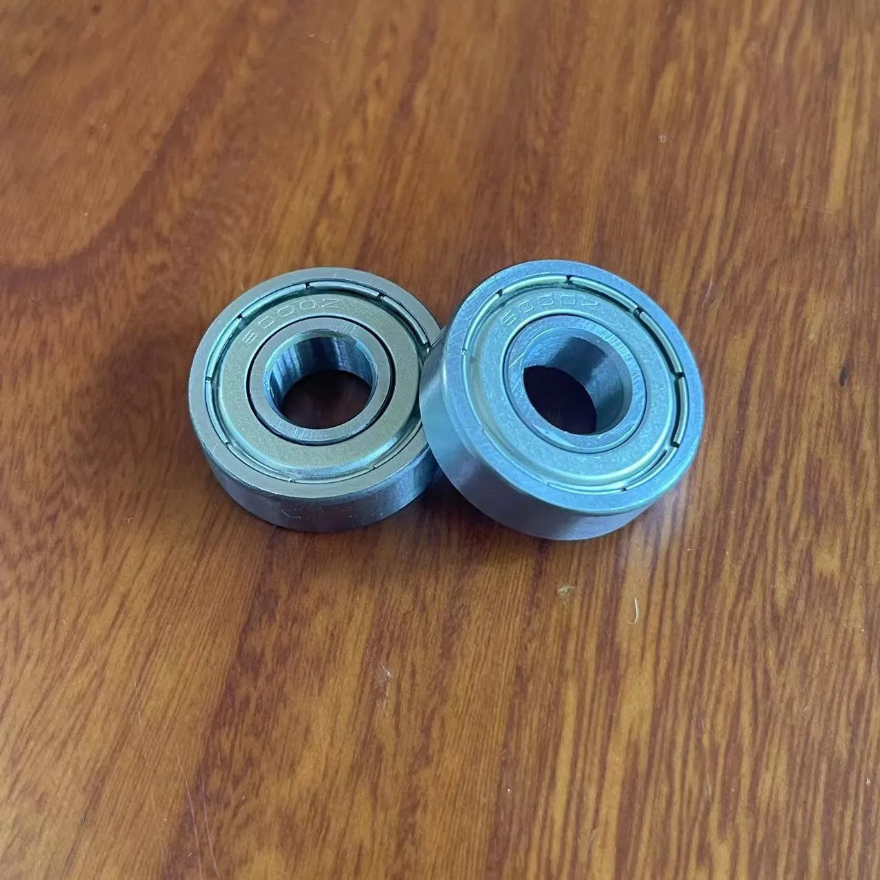 6000z carbon steel ball bearing showing 10mm bore, 26mm outer diameter, 8mm width, and iron cage.