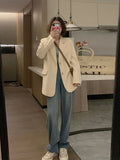 Milky white Korean-style street suit jacket with pockets on a model.