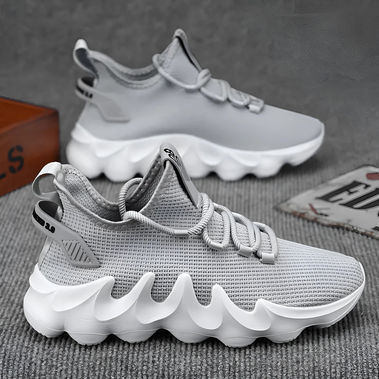 Men's grey lightweight sock-like sports shoes with flat heel and lace-up front