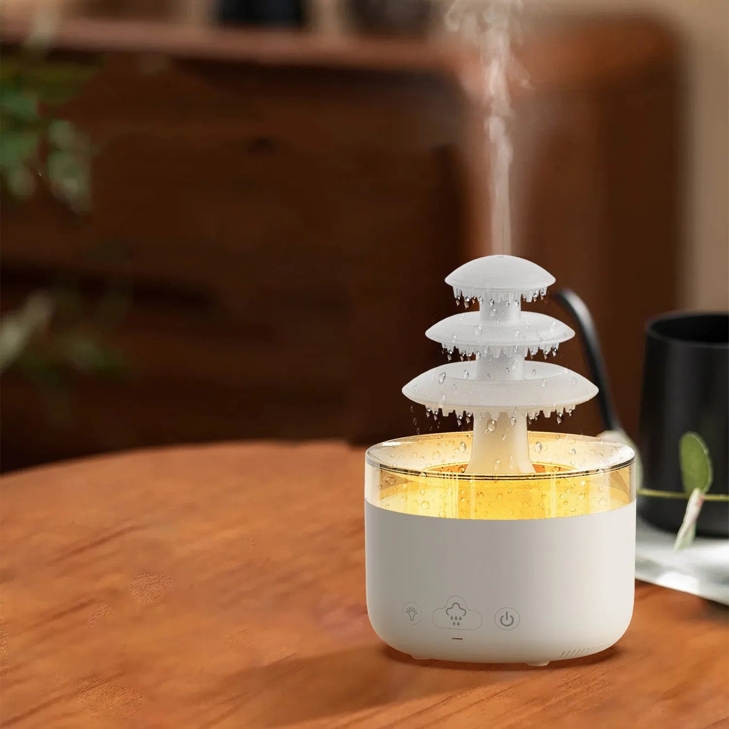 White plastic cloud rain effect USB air humidifier and essential oil diffuser with coloured lights.