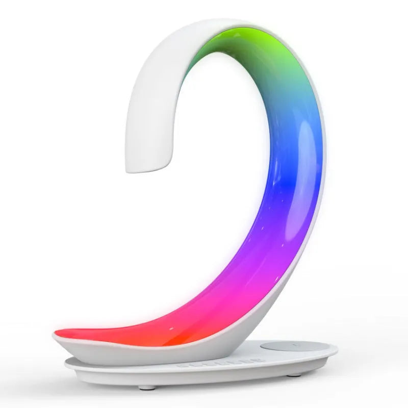 White swan-shaped desktop device with wireless charging, Bluetooth speaker, and colourful mood lighting functions