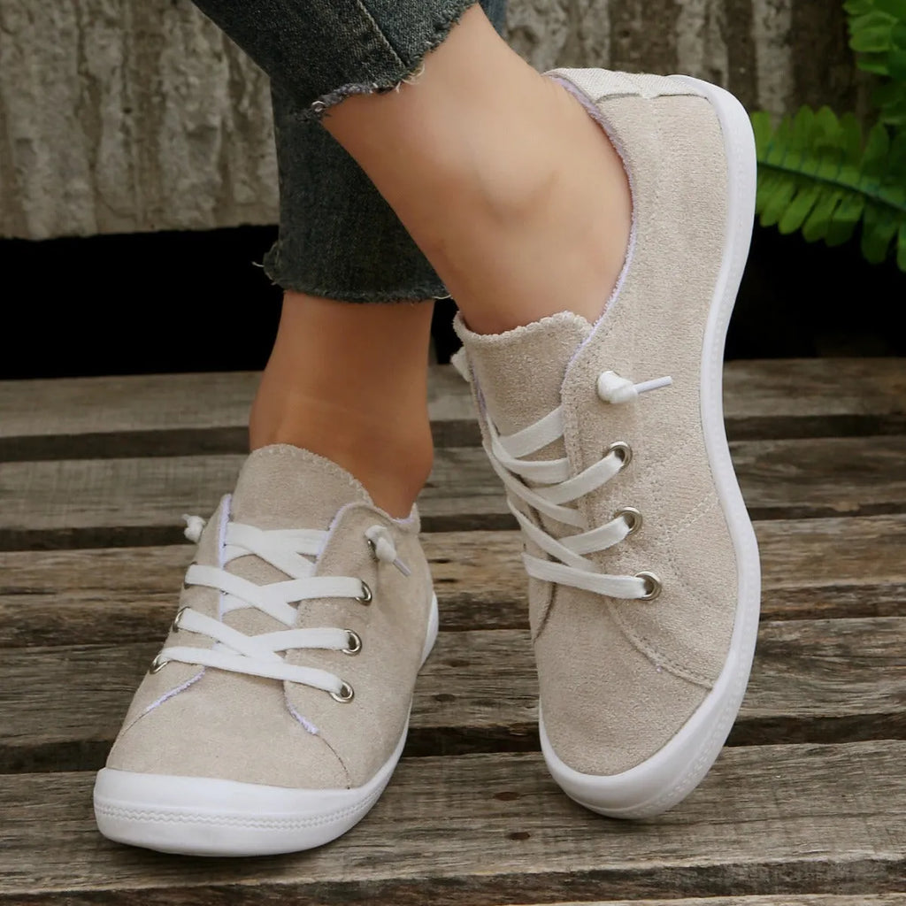 Women's creamy white casual sneakers with soft fabric upper and rubber sole
