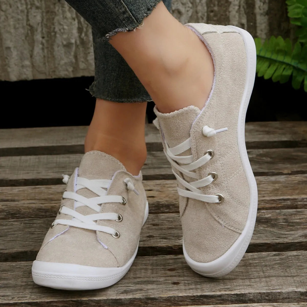 Women's creamy white casual sneakers with soft fabric upper and rubber sole