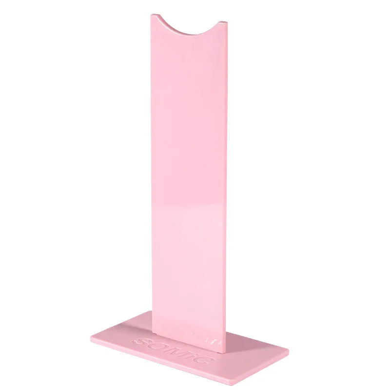 Detachable head-mounted headset bracket stand on a non-slip silicone base.