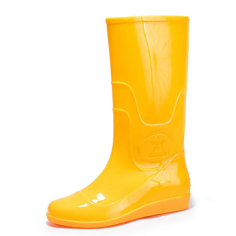 Men's flat washable plastic rain boot in white, showing high tube design and round toe.