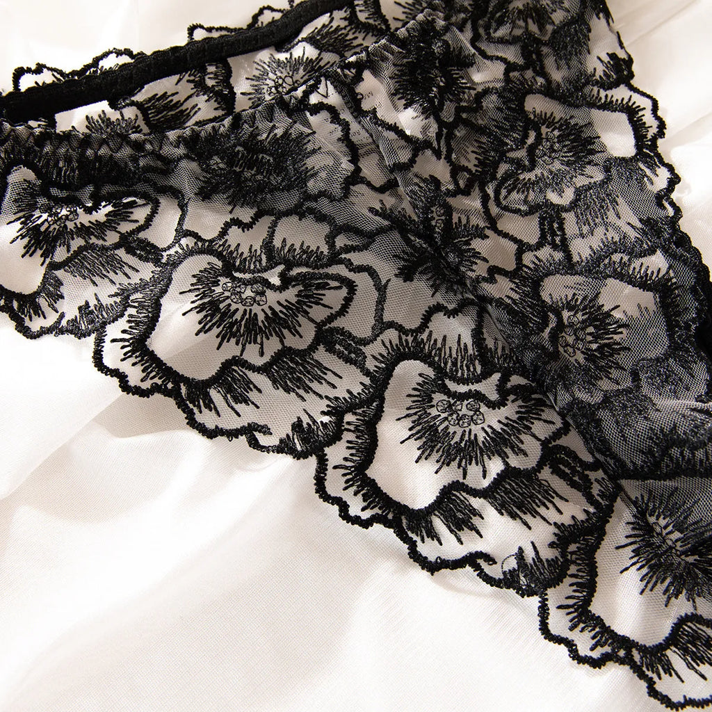 Black sheer lace women's underwear set with embroidered steel ring detail.