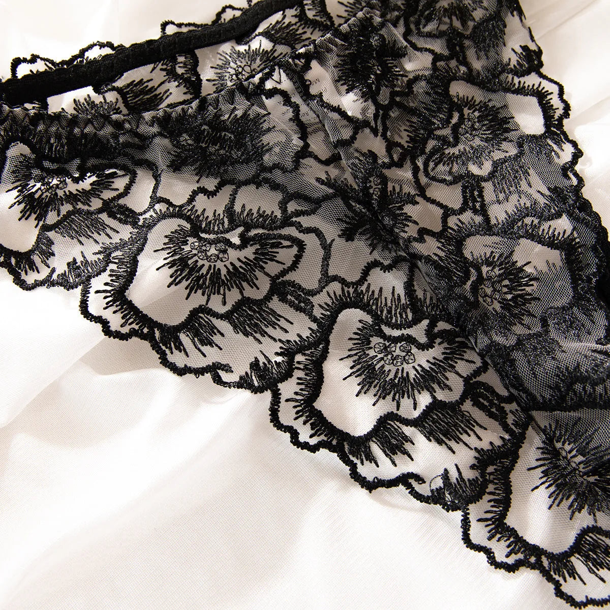 Black sheer lace women's underwear set with embroidered steel ring detail.