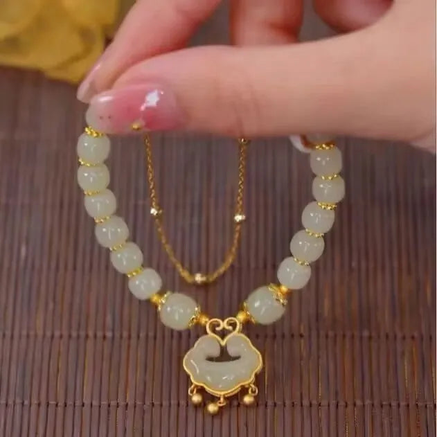 Green double-layer women's bracelet with safety lock bell pendant and drop-shaped charm