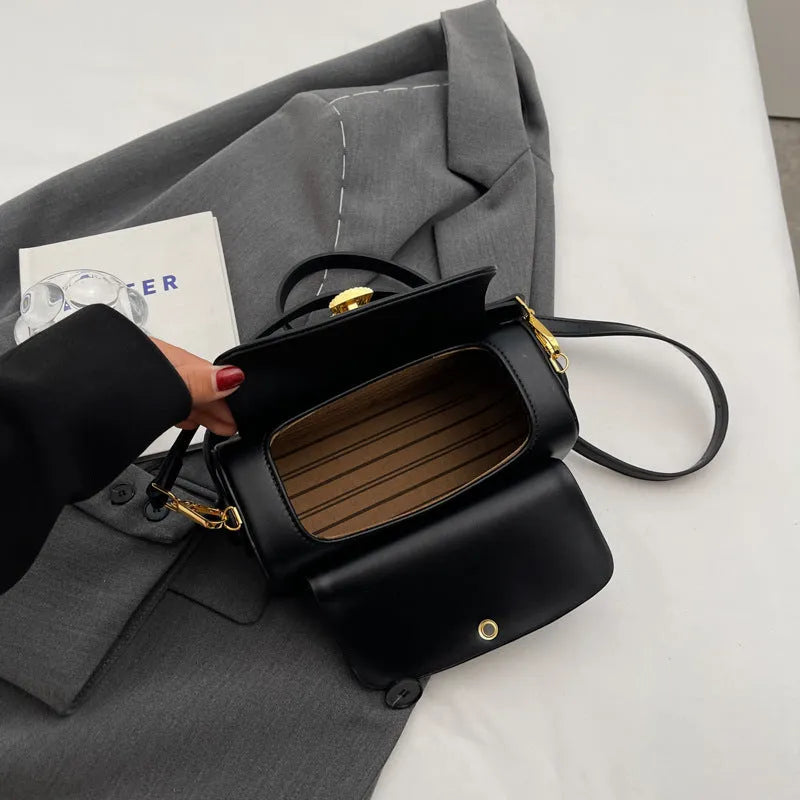 Women's personalised shoulder messenger bag in PU leather showing letter detailing and casual stitching