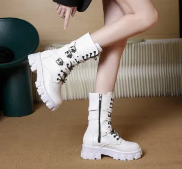 Black women's mid-calf boots with a metal buckle and side zipper on a round toe.