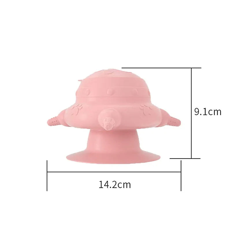 Pink silicone pet nursing bottle with four teats and a flat base.
