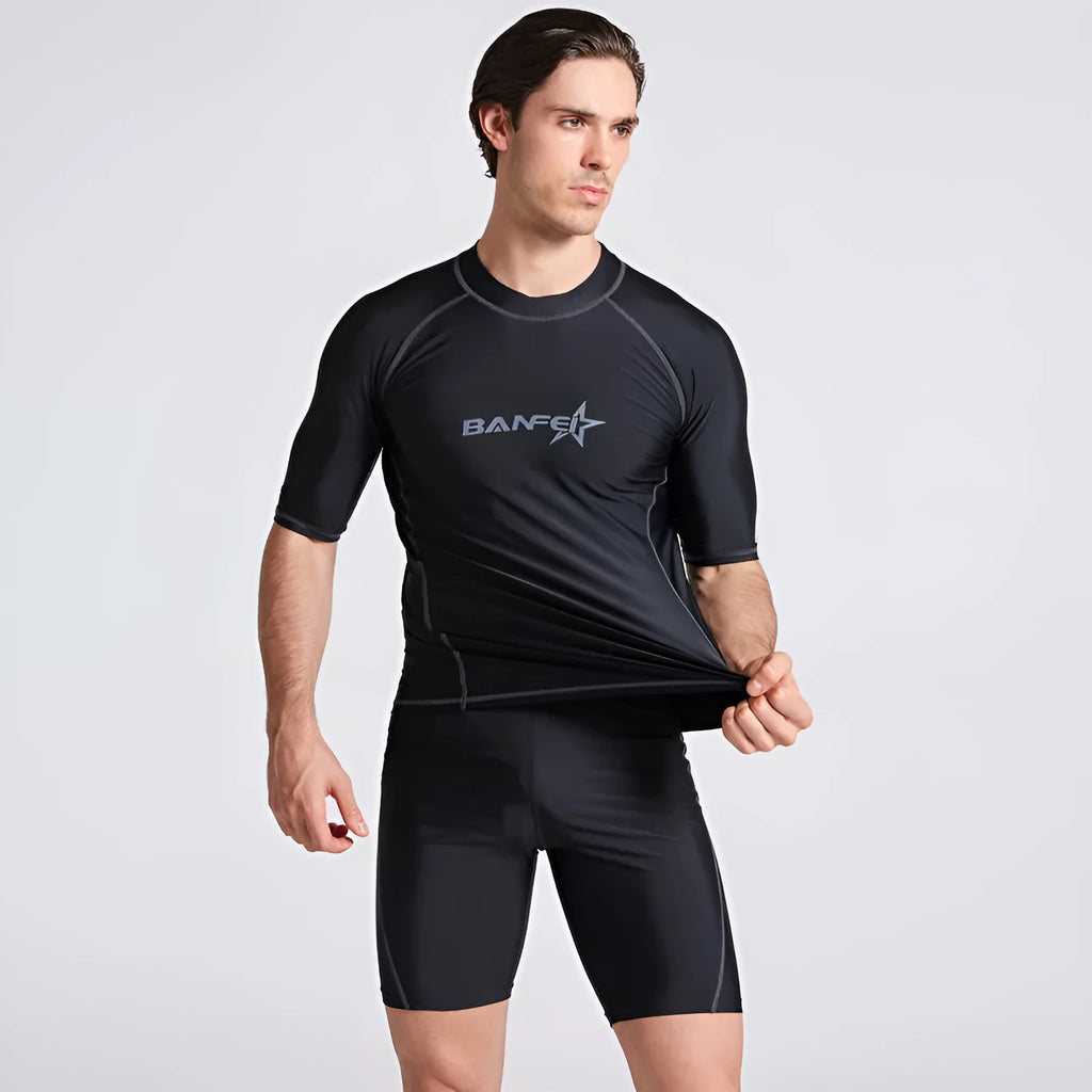 Men's quick-dry half sleeve swimsuit suit for snorkelling, showing separate nylon top and pants.