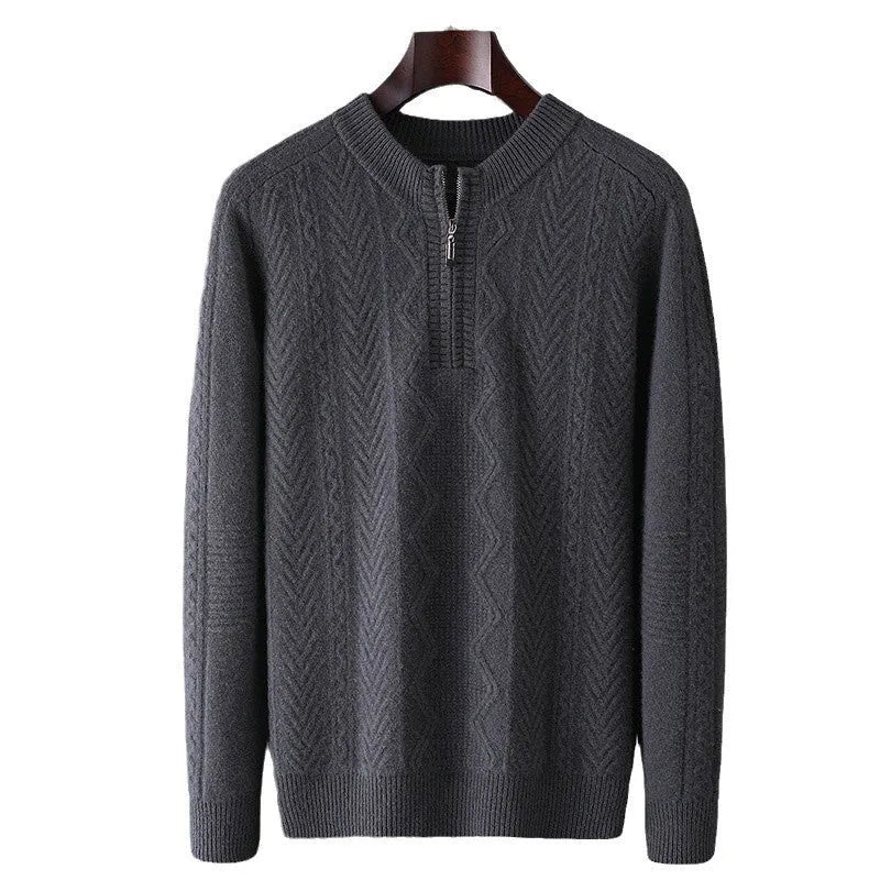 Man wearing a grey pure wool half-zip sweater with a diamond lattice pattern.