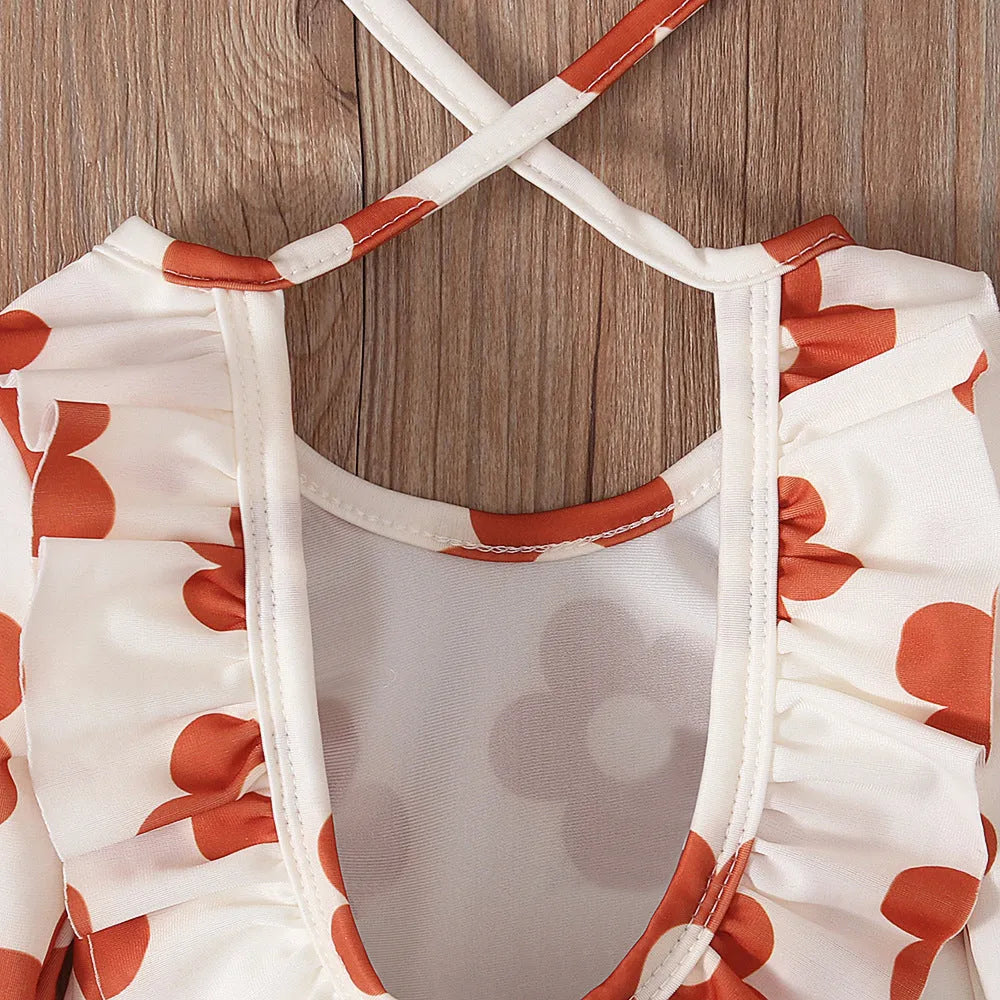 Girl's floral pattern swimsuit with crew neck and open back design in polyester fabric