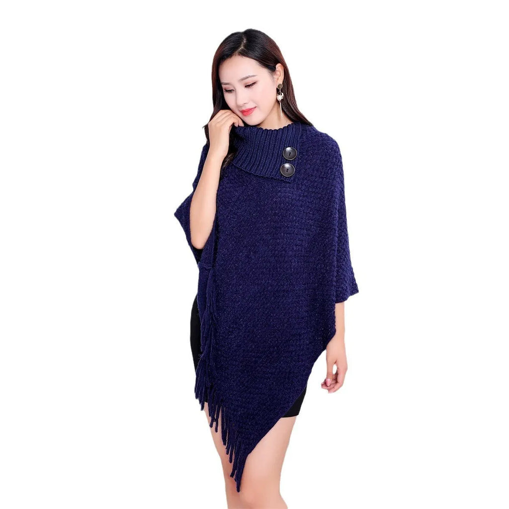 Dotted pattern sleeveless knitted cloak shawl in acrylic fibre, shown in apricot colour.