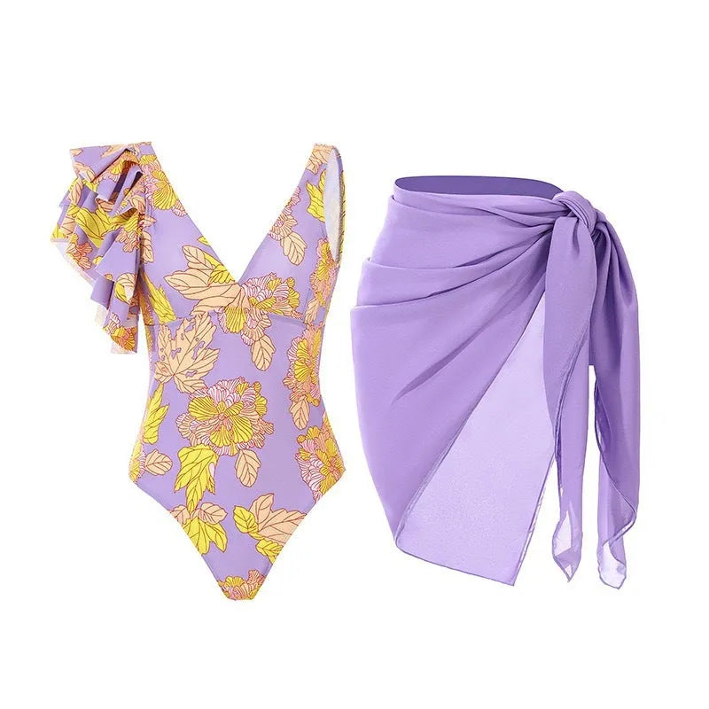 Solid colour women's one-piece swimsuit with thin spaghetti straps and a separate matching swim skirt.