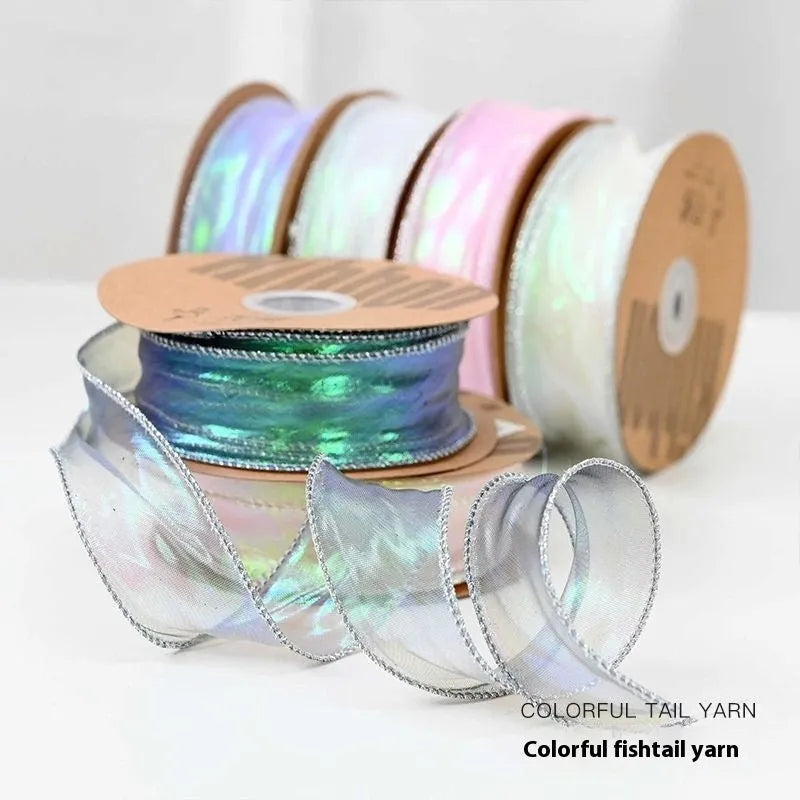 Roll of 4cm wide fishtail yarn ribbon with colourful wave pattern in multiple illusion colour options.