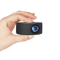 Black mini portable projector for mobile phones measuring 110mm with compact design for children's entertainment