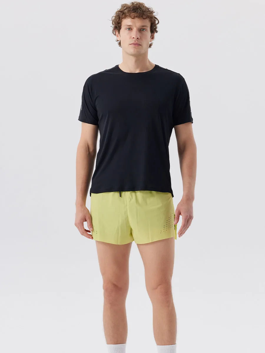 Men's turmeric yellow sports shorts with side slits, made from micro-elastic nylon fabric.