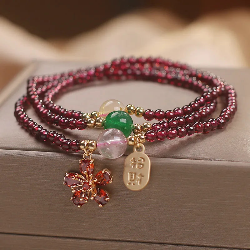 Natural crystal women's bracelet in pomegranate red cherry blossom colour with sequin detail
