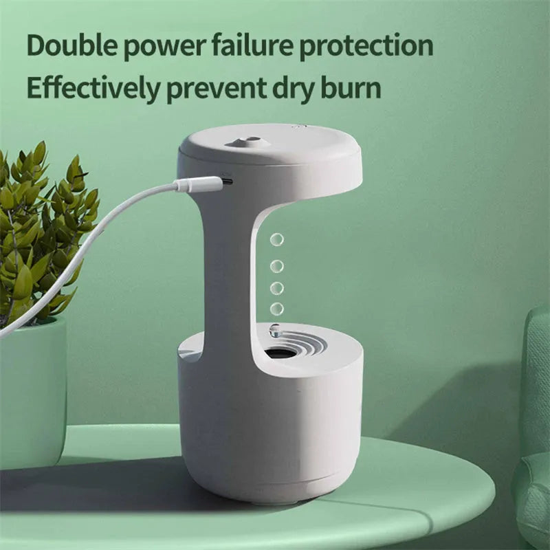 White anti-gravity humidifier with LED clock display emitting mist on a wooden desk.