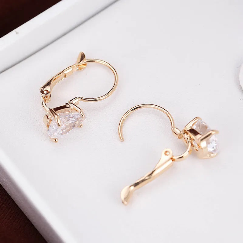 Women's drop-shaped copper earrings with gemstone inlay in gold or platinum colour options