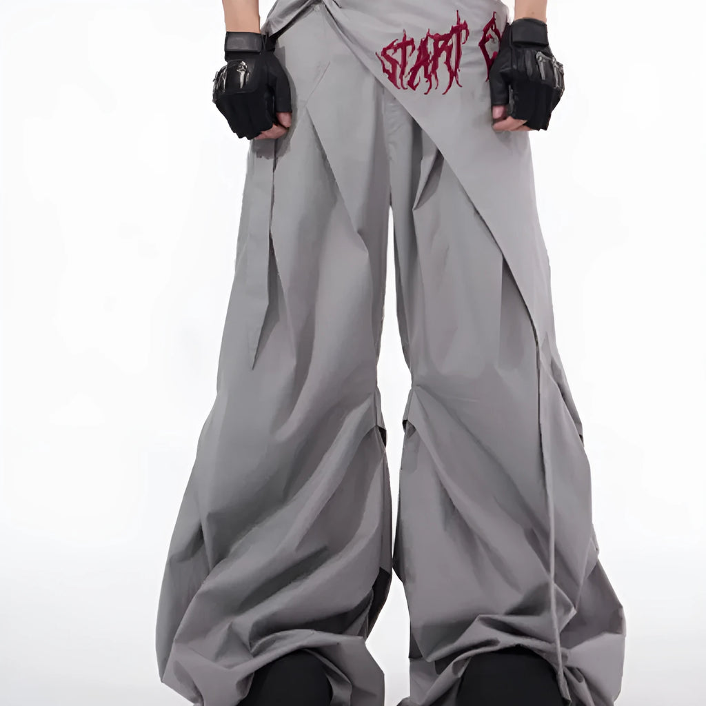 Boy wearing black wide-leg Korean style summer trousers with an elasticated waistband.