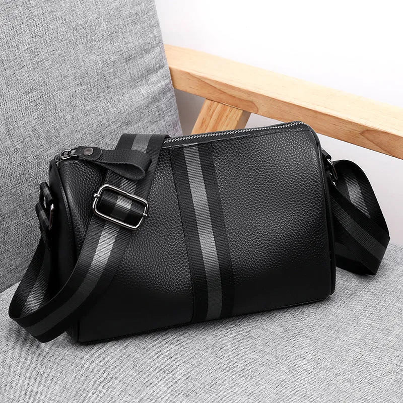 Black genuine leather women's crossbody bag with one-shoulder strap showing 24x16x13cm dimensions