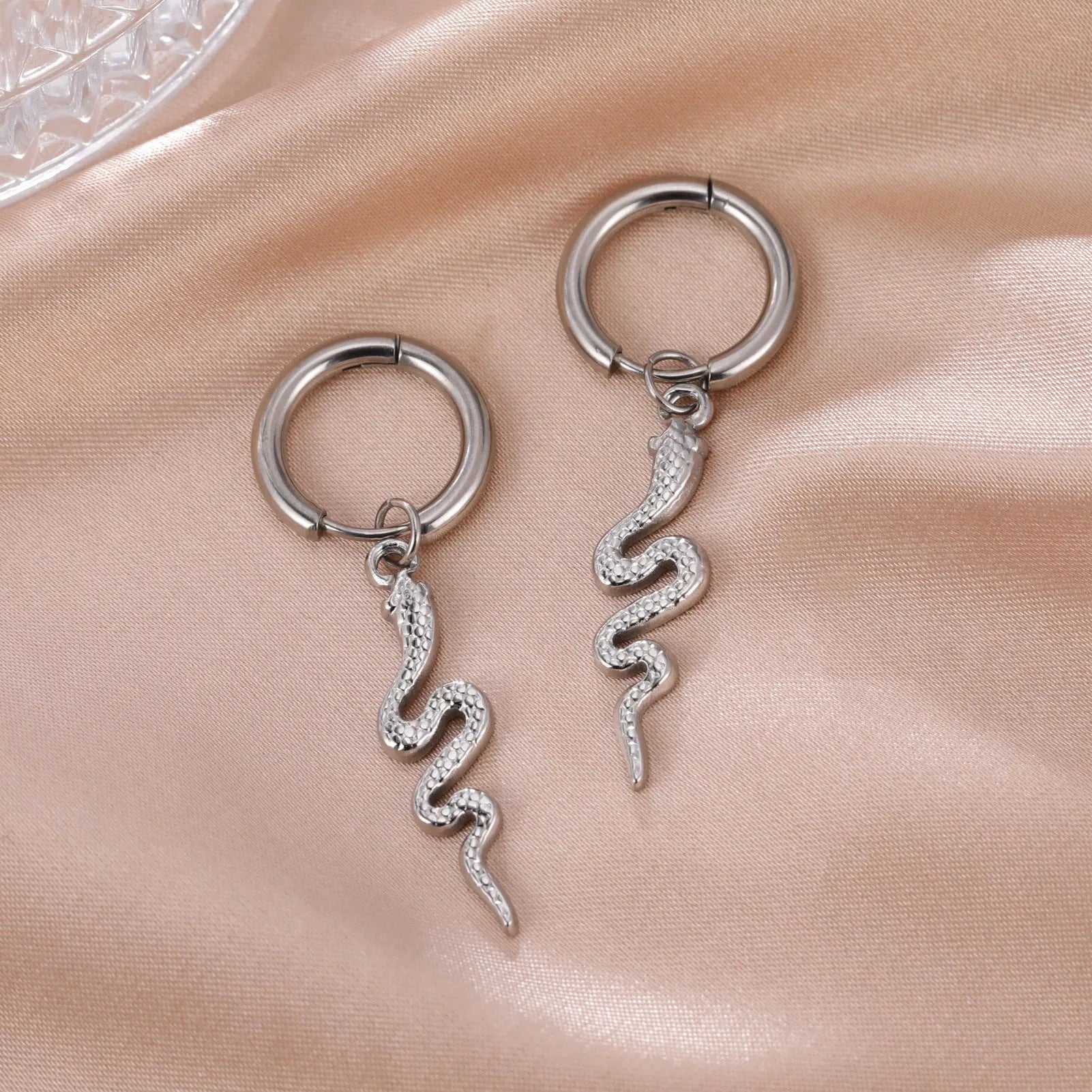 Gold plated stainless steel snake-shaped vintage earrings with ear clip fastening