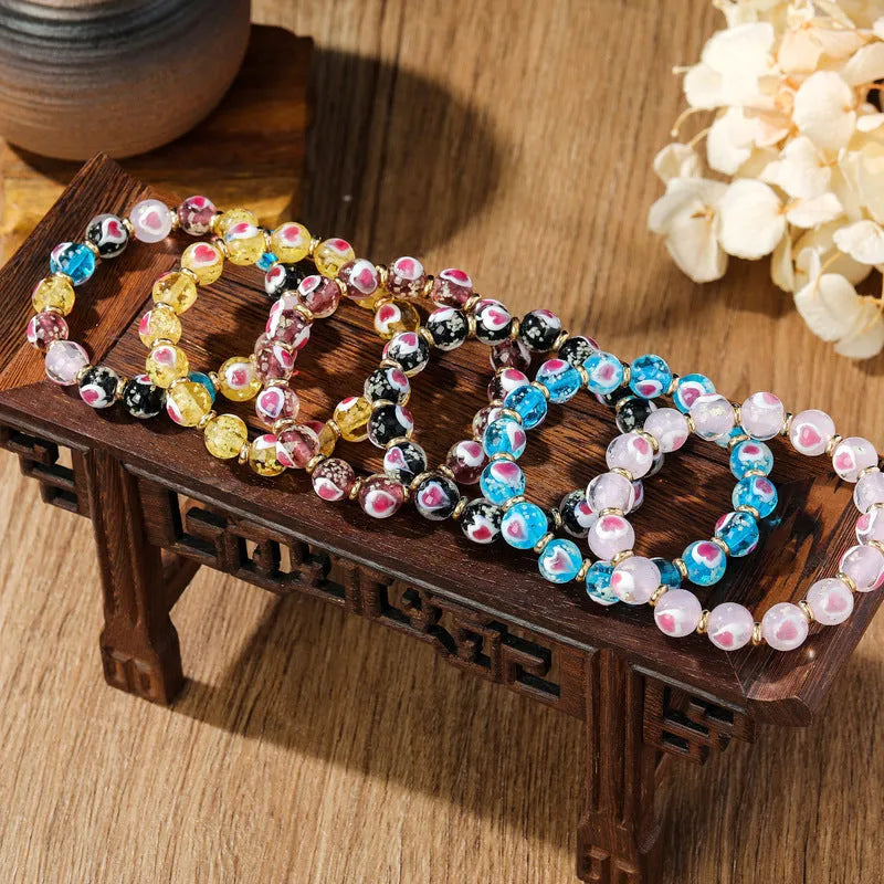 Swallowing gold beast cherry blossom powder heart bracelet with 10mm beads in six colour options