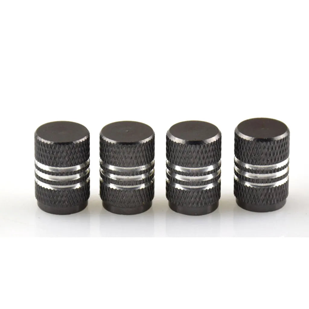 Set of stainless steel car tyre valve caps in multiple colours including red, blue, black, and silver.