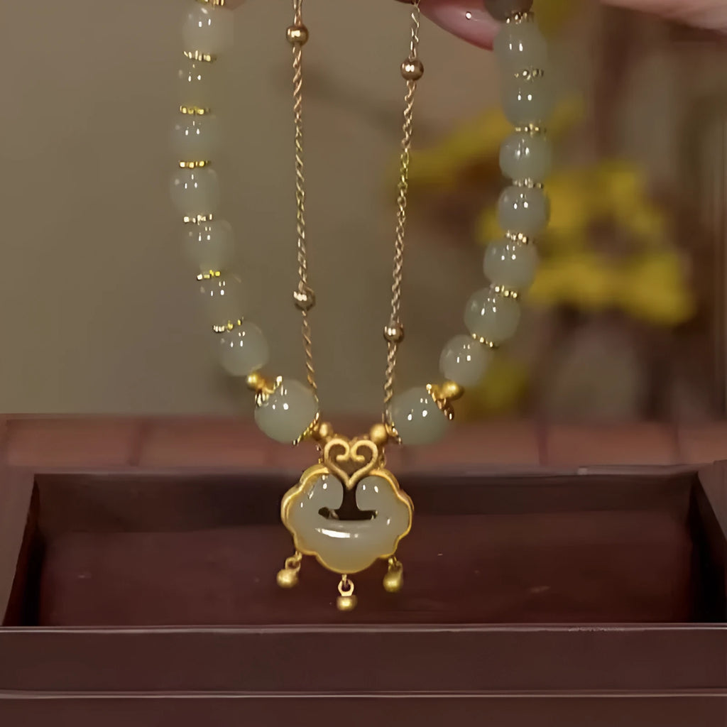 Green double-layer women's bracelet with safety lock bell pendant and drop-shaped charm