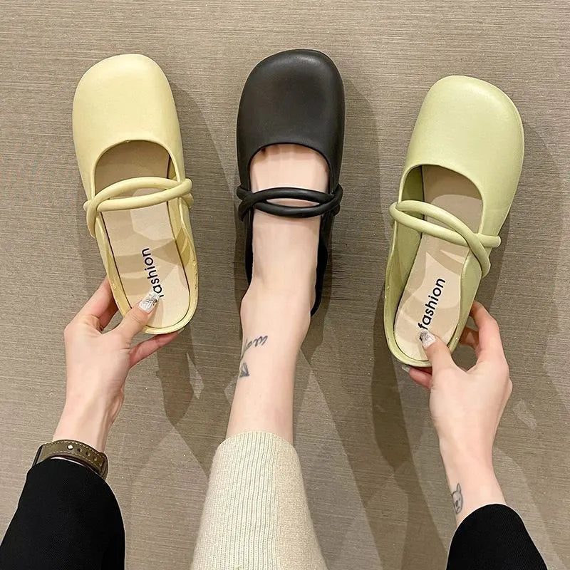 Women's plastic baotou flip flop sandals in green, shown from the side.