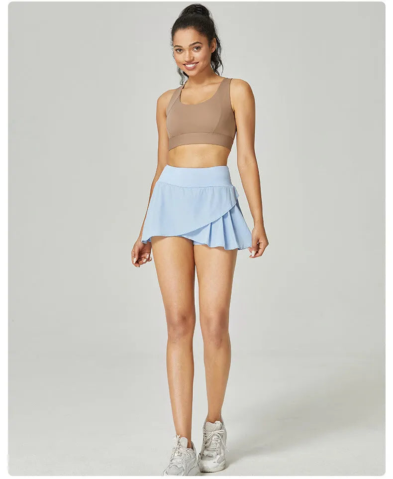 Women's solid colour waist-length quick-drying sports shorts on a hanger.