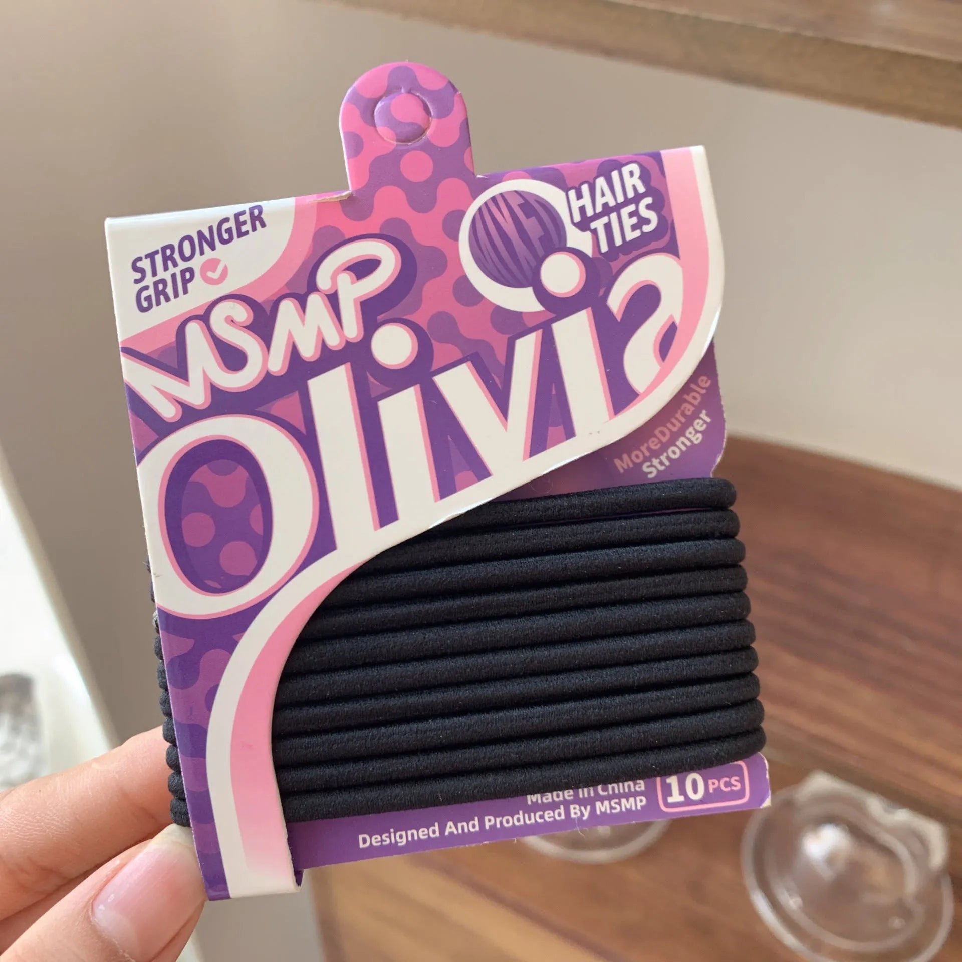 Assorted candy colour braided elastic hair bands laid flat, showing no metal parts.