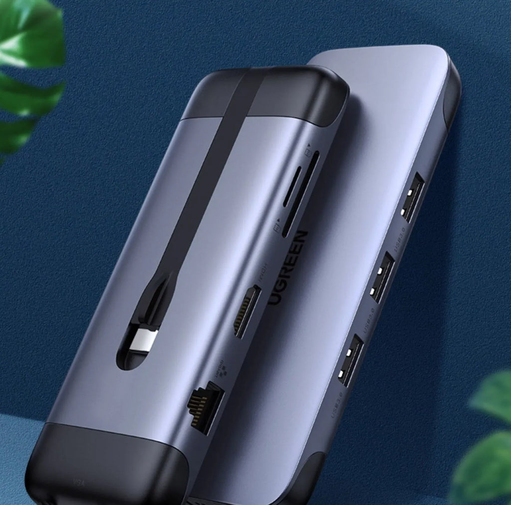 A compact USB-C docking station hub with ports for HDMI, VGA, Ethernet, USB 3.0, and power delivery.