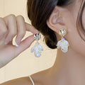 White shell flower stud earrings for women, retro butterfly and geometric design, one pair