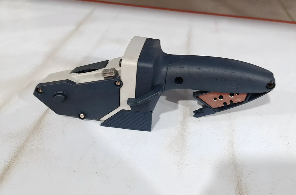 Blue multifunctional woodworking cutter with one-press lock and measuring scale for cutting boards.