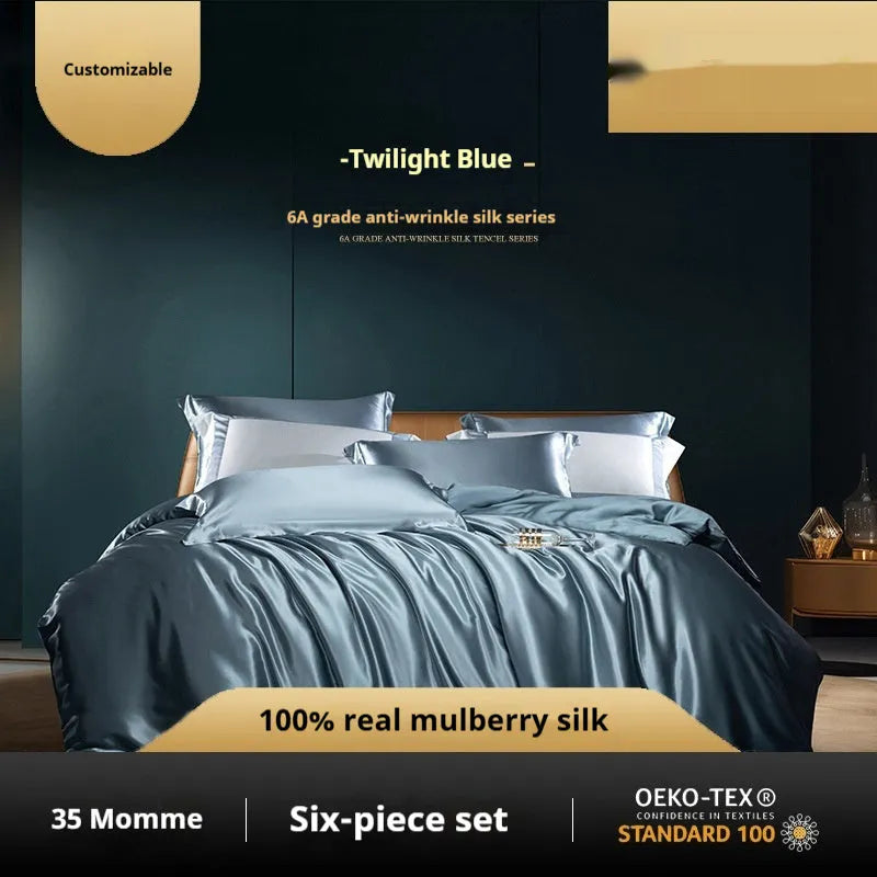 Silk four-piece quilt cover set in a solid light luxury colour, shown on a bed.
