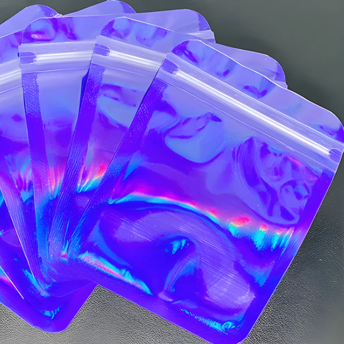 Laser internal printing ziplock bag in pink, 10x15cm size, with colourful internal print, lying flat on a surface
