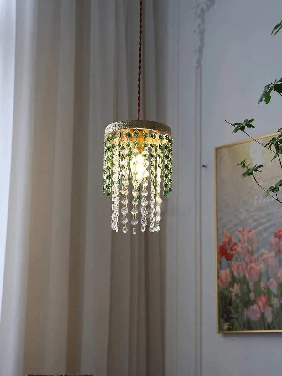 Retro green glacier bedside crystal small droplight with light luxury style on a wooden surface
