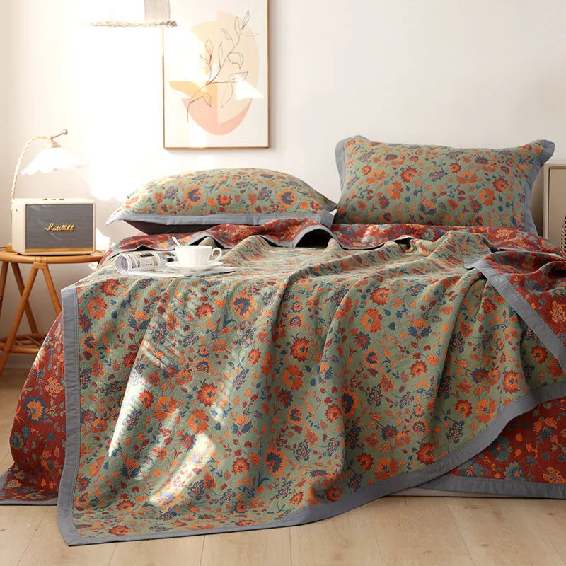 Cotton gauze bed blanket three-piece set with floral pattern showing blanket and two matching pillowcases