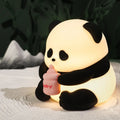 Colourful cartoon flower panda silicone night light with built-in battery on bedside table