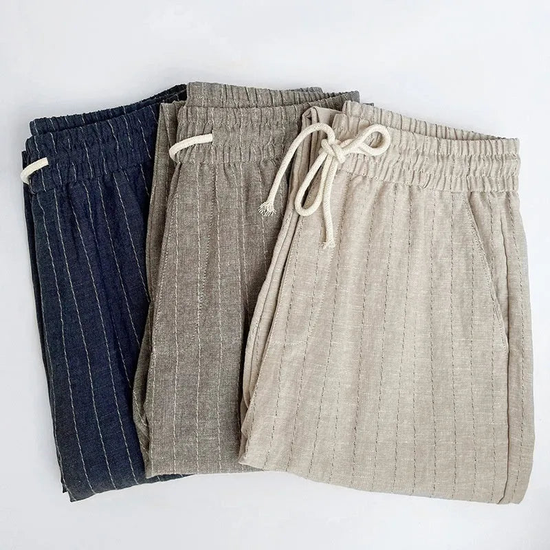 Men's lightweight cropped linen-cotton trousers in a striped pattern, shown in khaki colour.